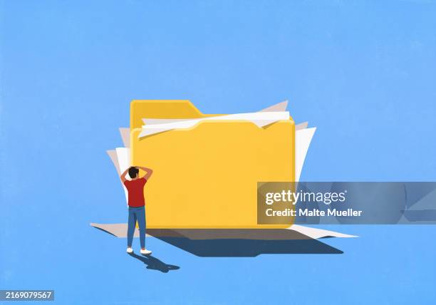 frustrated man looking at messy paperwork spilling out of large file folder - holding folder stock illustrations