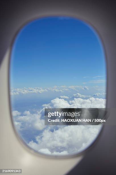 view seen through airplane window - plane window stock pictures, royalty-free photos & images