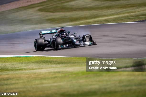 Lewis Hamilton, Mercedes F1 W11 EQ Performance, scrambles for the finsih line with a puncture on the final lap during the British GP at Silverstone...