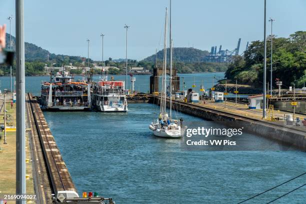 Ships passing through Miraflores Locks in the Panama Canal.