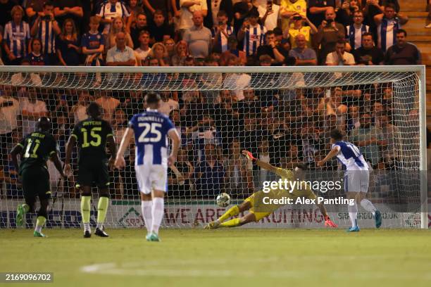 Hakon Valdimarsson of Brentford saves a penalty shot from Jack Payne of Colchester United during the Carabao Cup Second Round match between...