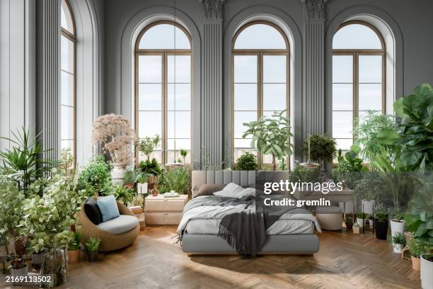 classic seaside villa bedroom - flower bed stockfoto's en -beelden