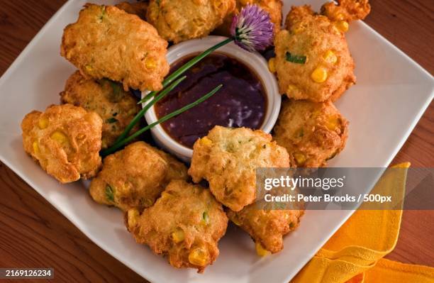 high angle view of fried chicken and sauce served in plate on table - fritter stock pictures, royalty-free photos & images