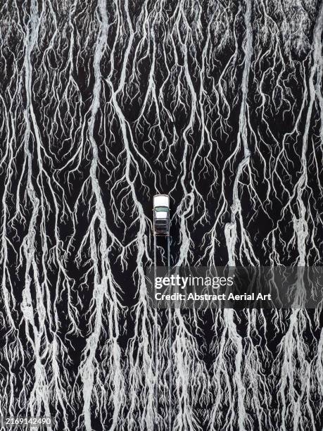 4x4 driving across braided channels of ocean water created by the outgoing tide photographed from a drone point of view, cable beach, broome, western australia, australia - eroded stock pictures, royalty-free photos & images