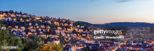 germany, baden-wurttemberg, stuttgart, hillside houses in haigst district at dusk - einfamilienhaus deutschland stock-fotos und bilder