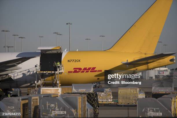 Cargo is offloaded from an aircraft operated by DHL at Sydney Airport in Sydney, Australia, on Tuesday, Aug. 27, 2024. Australia's government will...