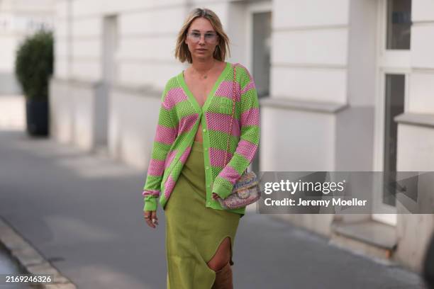 Karin Teigl seen wearing silver tinted aviator glasses, Van Cleef & Arpels Alhambra gold / green necklace, Miu Miu pink and neon green striped...