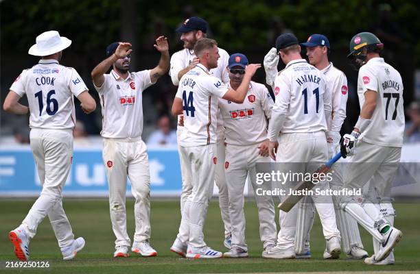Jamie Porter of Essex celebrates taking the wicket of Ethan Brookes of Worcestershire during the Vitality County Championship match between Essex and...