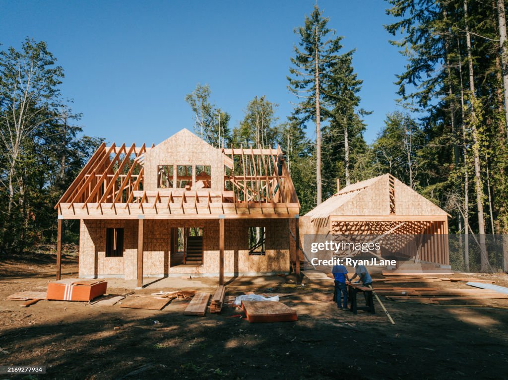 Construction Crew Putting Up Framing of New Home