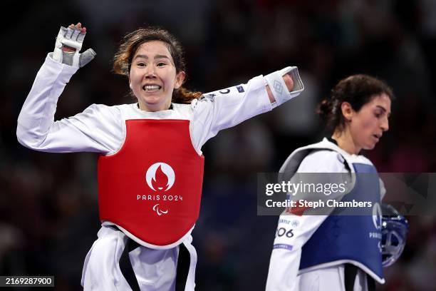 Zakia Khudadadi of Refugee Paralympic Team celebrates after winning the Women's Taekwondo K44 -47kg Repechage contest against Nurcihan Ekinci of Team...