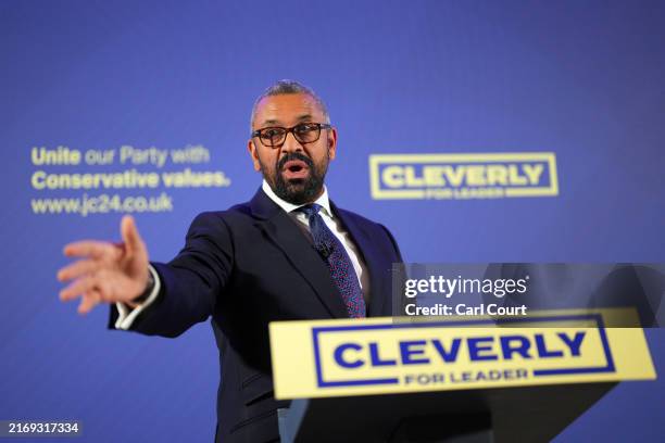 Britain's Shadow Home Secretary, James Cleverly, gestures during a press conference to announce his bid for Conservative Party leadership, on...