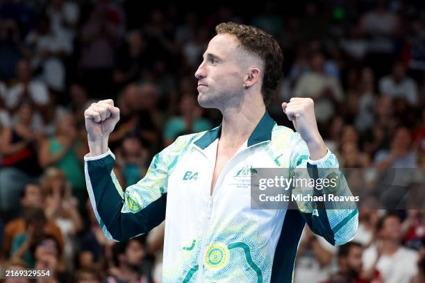 Gold Medallist Thomas Gallagher of Team Australia celebrates on the podium during the medal ceremony for the Men's 50m Freestyle S10 Final on day one...