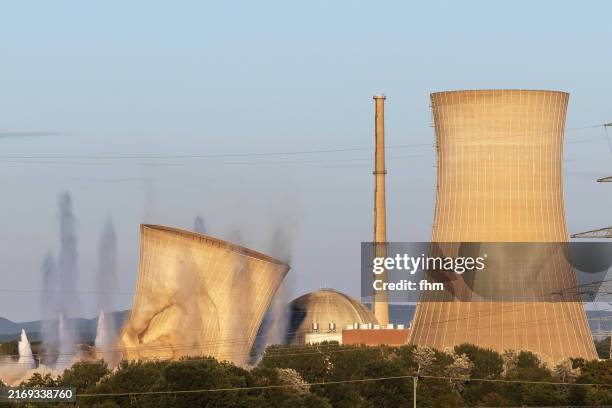demolition of the cooling towers of the nuclear power plant grafenrheinfeld/ bavaria, germany - kühlturm stock-fotos und bilder