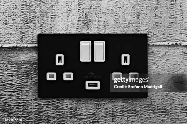 uk power outlet, light and energy - plug socket stock pictures, royalty-free photos & images