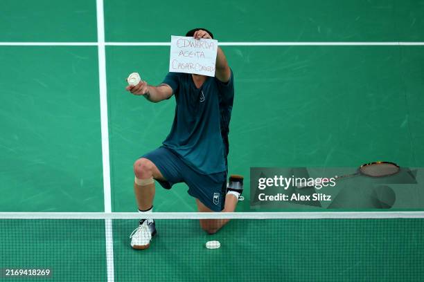 Rogerio Junior Xavier de Oliveira of Team Brazil holds a sign which translates to 'Edwarda Will You Marry Me?' whilst proposing during the Men's...