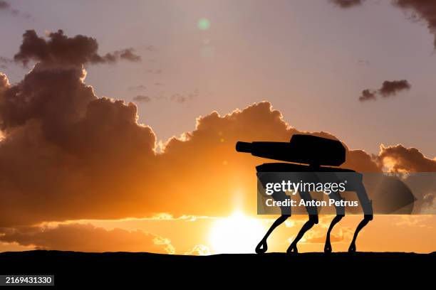 robot with a machine gun. military robots - cyborg army stock pictures, royalty-free photos & images