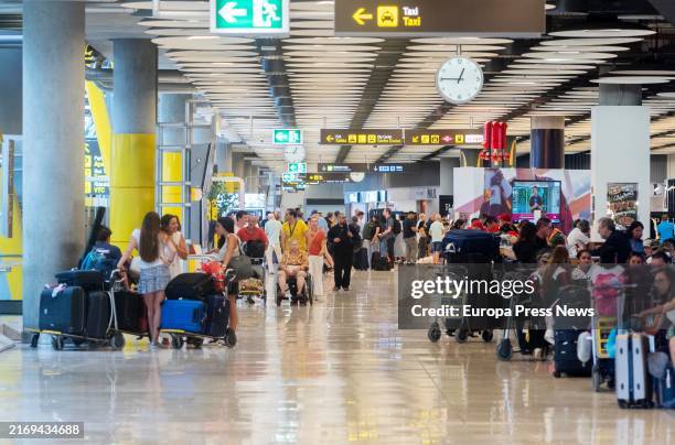 Several people with suitcases at terminal T4 of Adolfo Suarez Madrid-Barajas airport, on 30 August, 2024 in Madrid, Spain. The airlines operating at...