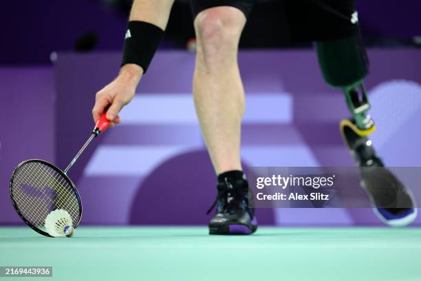 Wojtek Czyz of Team New Zealand picks up the shuttle coq during the Men's Singles SL3 Group Play Stage - Group B match against Oleksandr Chyrkov of...