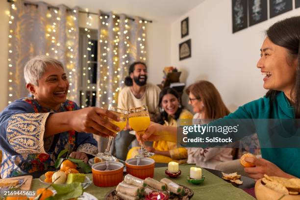 toasting to a great diwali - religious celebration stock pictures, royalty-free photos & images