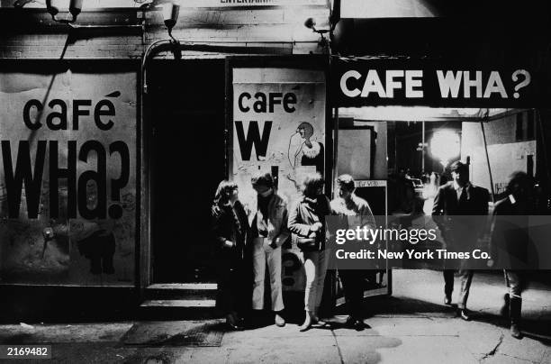 Group of people stand outside the Cafe Wha? nightclub at 113 MacDougal Street in Greenwich Village, New York City, April 21, 1966.