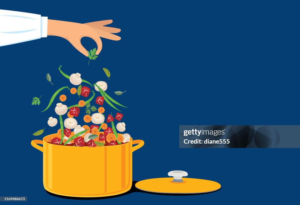 Hand Adding Ingredients Into A Soup Pot