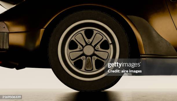 front view of a parked car wheel in a dark parking lot 3d rendered image without people - wiel stockfoto's en -beelden