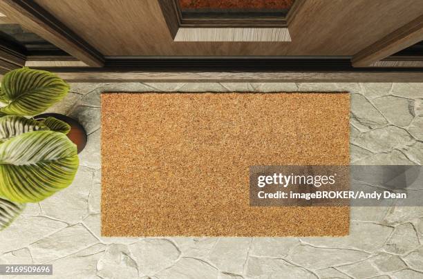 overhead of blank doormat on the porch at the front door - zerbino foto e immagini stock