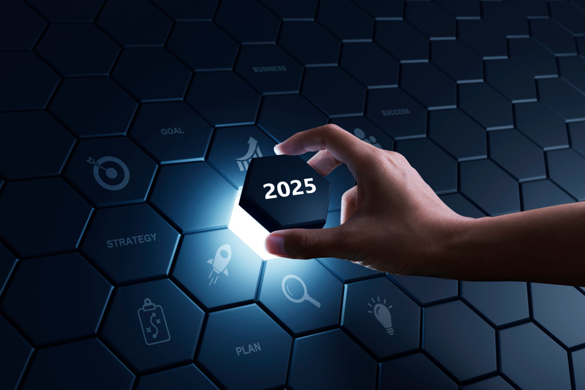 Hand of human putting hexagon piece to full fill the part of 2025. Hand of human putting hexagon piece to full fill the part of 2025.