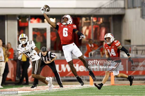 Xavier Lucas of the Wisconsin Badgers intercepts a pass in the fourth quarter against the Western Michigan Broncos at Camp Randall Stadium on August...