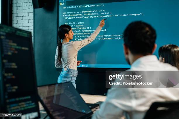 young female software developer presenting the program coding language projection the large screen in meeting room. - subcontinente indiano ásia imagens e fotografias de stock