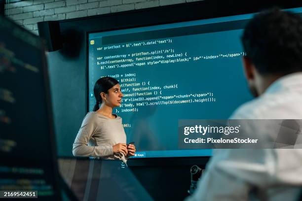 young female software developer presenting the program coding language projection the large screen in meeting room. - training program stock pictures, royalty-free photos & images