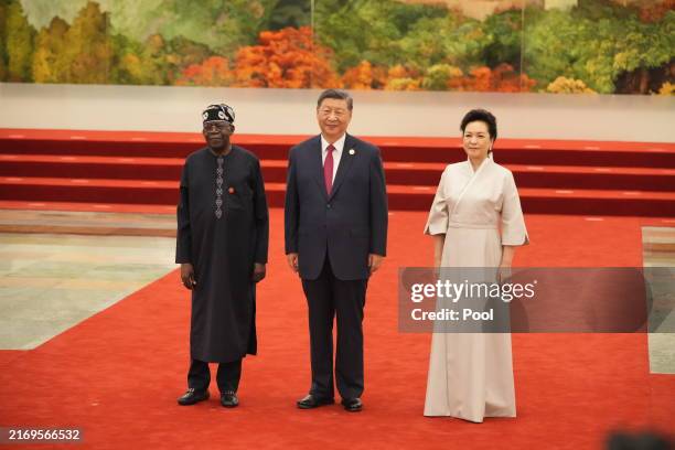 Nigeria's President Bola Ahmed Tinubu, China's President Xi Jinping and his wife Peng Liyuan pose for a photo ahead of the dinner reception of the...