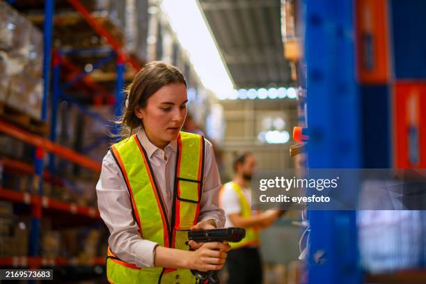 blue collar worker are working warehouse. - scan barcode stock pictures, royalty-free photos & images