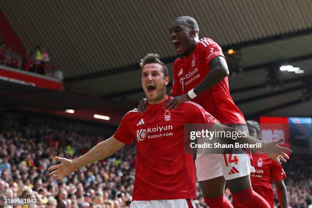 Chris Wood of Nottingham Forest celebrates scoring his team's first goal with team mate Callum Hudson-Odoi during the Premier League match between...