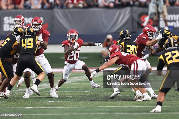 Arkansas Running Razorback Arkansas Razorbacks running back Rodney Hill runs up the middle of ...