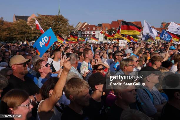 Supporters of the far-right Alternative for Germany political party gather at the final AfD campaign rally ahead of tomorrow's Thuringia state...