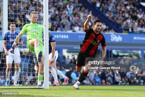 Lewis Cook of AFC Bournemouth celebrates scoring his team's second goal during the Premier League match between Everton FC and AFC Bournemouth at...