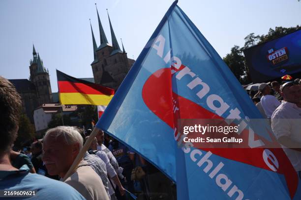 Supporters of the far-right Alternative for Germany political party gather at the final AfD campaign rally ahead of tomorrow's Thuringia state...