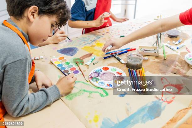 child boy doing painting activity at school - trabalho manual imagens e fotografias de stock
