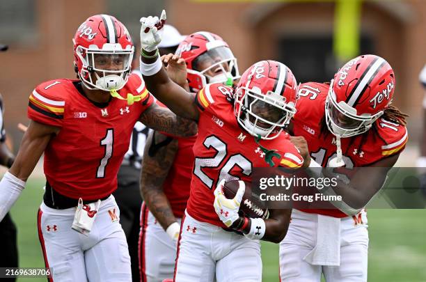 Shamar McIntosh of the Maryland Terrapins celebrates with teammates after recovering a fumble in the fourth quarter against the Connecticut Huskies...