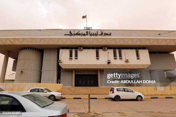 Cars parked in front of Libya's Central Bank branch the southern city of Sebha on September 4, 2024.