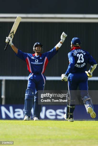 Vikram Solanki of England celebrates his first international century with team-mate Marcus Trescothick during the second match of the NatWest one day...