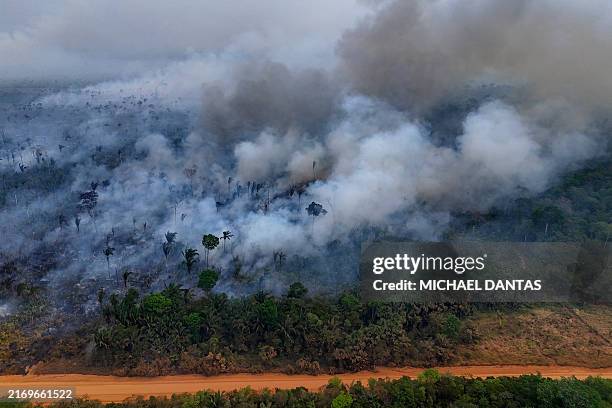 Aerial view of an illegal fire in the Amazon rainforest on the banks of the BR-230 , near the city of Labrea, Amazonas state, northern Brazil, taken...