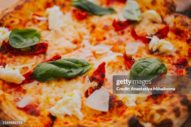 pizza with cheese and vegetables in close-up. the texture of a delicious pizza - cheese pizza stock pictures, royalty-free photos & images
