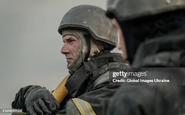 Portrait of a rescuer working in a residential district hit by Russian shelling with aerial bombs on August 31, 2024 in Cherkaska Lozova, Kharkiv...