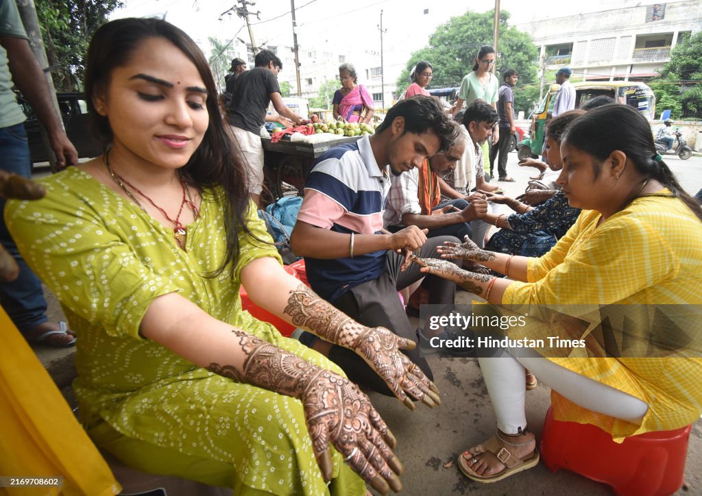 Indian Women Put Mehndi On Their Hands On Eve Of Teej Festival
