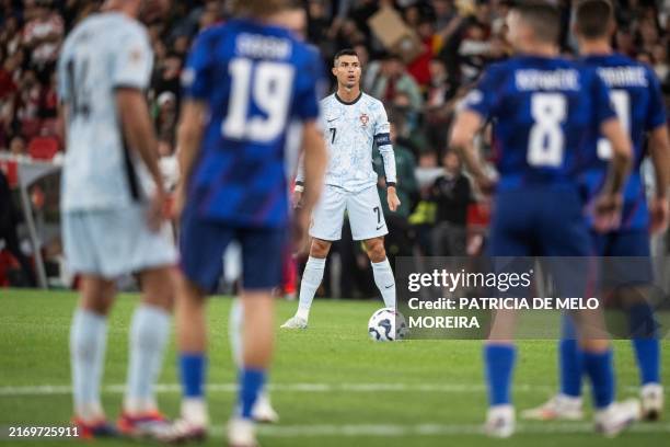 Portugal's forward Cristiano Ronaldo prepares to take a free-kick during the UEFA Nations League group A football match between Portugal and Croatia...