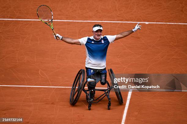 Stephane Houdet of France celebrates winning matchpoint against Dahnon Ward of Great Britain in the Men's Wheelchair Tennis Singles second round...