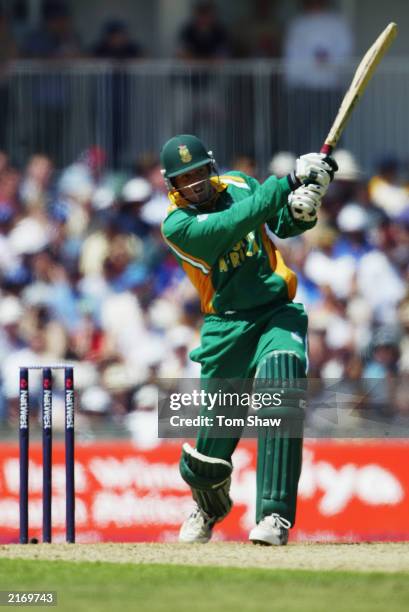 Shaun Pollock of South Africa hits out during the second match of the NatWest one day triangular series between England and South Africa held on June...