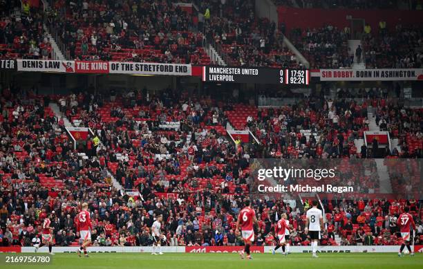 General view inside the stadium, showing empty seats in stands, as the LED Screen shows the score during the Premier League match between Manchester...